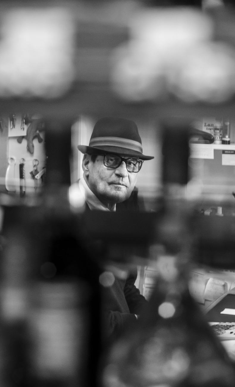 Black-and-white portrait through shelving